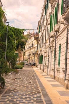 Sicily, Messina, Italy - 26 September 2023 – Street view near centre with famous cathedral in background. City views, facades, architecture and the most popular streets.