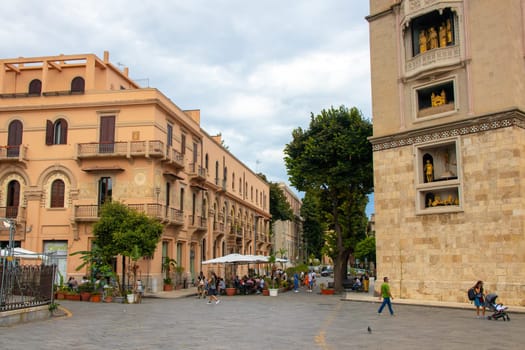 Sicily, Messina, Italy - September 26, 2023 - Street view in the city center of Messina next to the cathedral. City views, facades, architecture and the most popular streets.