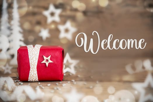 Text Welcome, With Christmas Gift, Wooden Background, Stars, Winter or Christmas Decoration