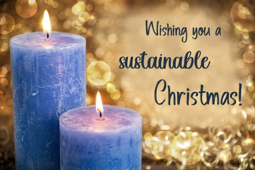 Text Wishing You Sustainable Christmas, With Blue Candles, Warm And Cozy Winter Background, Golden Christmas Decoration