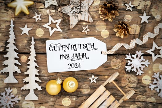 Rustic Wooden Bokeh Christmas Background, Winter Decoration With Label With German Text Guten Rutsch Ins Jahr 2024, Which Means Happy New Year 2024 In English