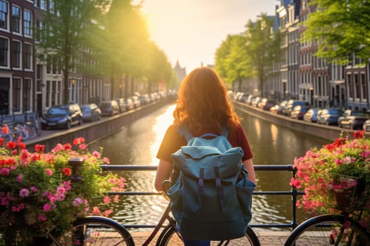 Young female tourist backpacker travelling aroung the world. Travel Destination - Amsterdam