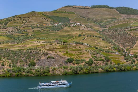 Pinhao, Portugal - August 25, 2023: Boat carrying tourists on the Douro River, Vila Real, Portugal