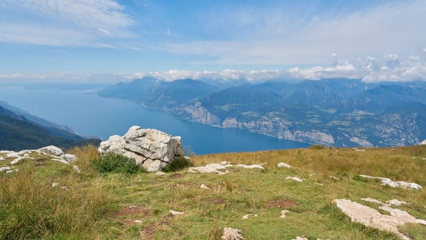 Breathtaking view from the summit of Monte Baldo to the blue waters of Lake Garda near Malcesine in Italy