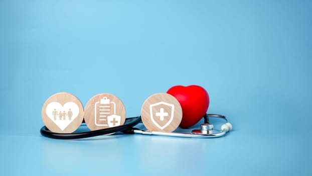 The concept of health insurance and medical welfare. Circle wood and red heart with icon. Health insurance and access to health care.