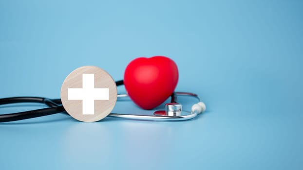 The concept of health insurance and medical welfare. Circle wood and red heart with icon. Health insurance and access to health care.