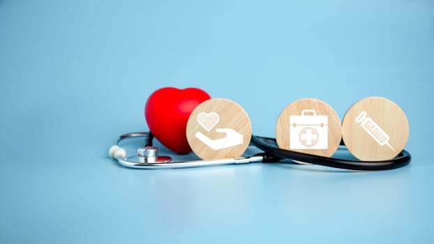 The concept of health insurance and medical welfare. Circle wood and red heart with icon. Health insurance and access to health care.
