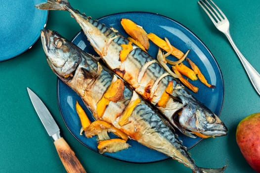 Appetizing mackerel fish roasted with mango. Healthy homemade food. Cookbook recipe.