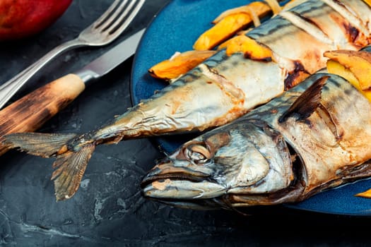 Appetizing mackerel fish roasted with mango. Healthy homemade food. Cookbook recipe.