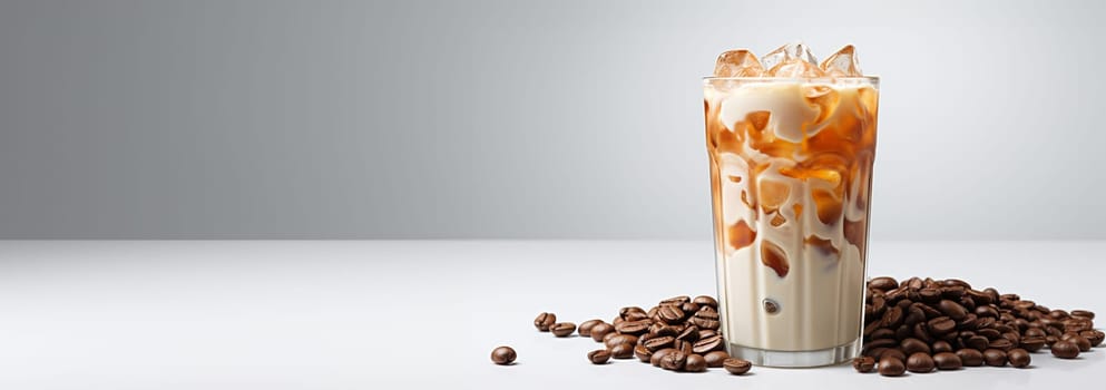 Latte coffee with milk on white background. cold brewed iced latte coffee, showing separate in a layer the bottom as milk top by coffee shot in a plastic glass. isolated white background Copy space Spcae for text