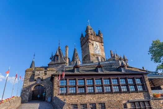 Cochem, Germany, August 10, 2023. Beautiful view of the hilltop castle (Reichsburg Cochem) in the touristic town of Cochem on the Moselle River in Rhineland-Palatinate in Germany.
