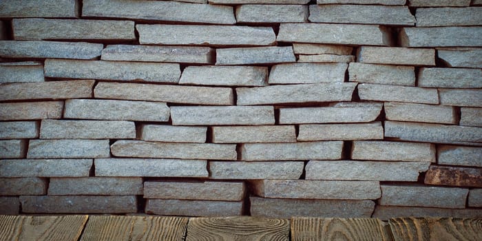 The background is blank wooden boards and a textured brick wall with lighting and vignetting. For product demonstrations, free space, layout, mockup, perspective board, background board.