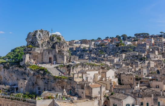 Matera, Italy - 6 May 2023: Old town of Matera (Sassi di Matera), Basilicata, southern Italy. Prehistoric cave dwellings