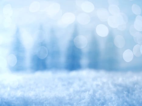 Bokeh background with winter landscape, trees and snow, space for your text or image