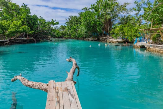Port Vila, Vanuatu: 01 June 2023: People swimming in Blue Lagoon, a popular scenic turquoise swimming hole near Port Vila, Efate Island, Vanuatu, Melanesia