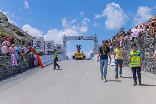 Col du Tourmalet, France - July 06 2023: Cycling fans waiting for the buch at the top of the Col du Tourmalet in Pyerenees mountains during the stage 6 of Le Tour de France 2023