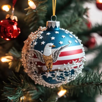 Christmas tree decoration Ball on a Christmas tree with an American-themed pattern on the background of a green Christmas tree. Holiday, Christmas, New Year, toys.