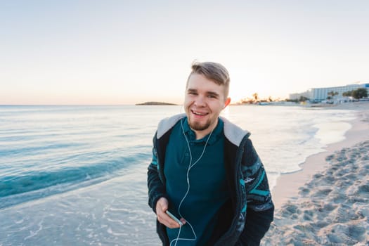 handsome portrait man listening to music smartphone