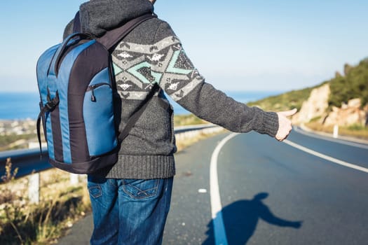 Hitchhiker sign thumb up on Highway road Outdoor.