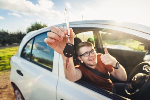 Happy customer just bought a car at car dealership.