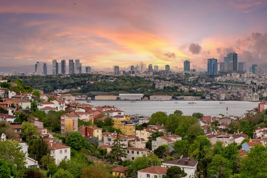 Cityscape of Istanbul, Turkey before sunset, with a skyline including Bosphorus strait, and tall buildings on the European side of the city