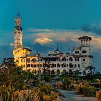 Night view of the Royal Montaza Palace in Alexandria, Egypt. The palace is a popular tourist destination and is known for its stunning architecture and gardens