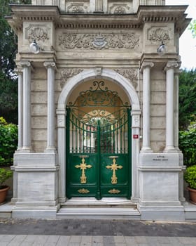 Green Gate with Gold Crosses framed by elegant marble decorations, at the Entrance of Agios Greek Orthodox Panteleimonas Church, located in Kuzguncuk neighborhood, Uskudar, Istanbul, Turkey