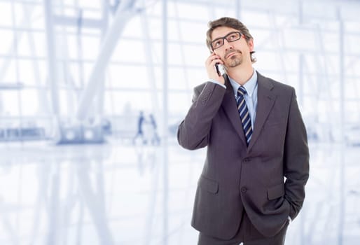 happy business man on the phone, at the office