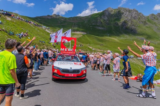Col du Tourmalet, France - July 06 2023: Caravan car at the top of the Col du Tourmalet in Pyerenees mountains during the stage 6 of Le Tour de France 2023