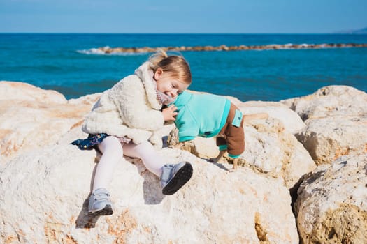 Little girl with chihuahua dog, outdoor summer.
