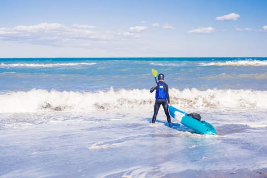 Men by sea kayaking. Traveling by kayak. Leisure activities on the water.