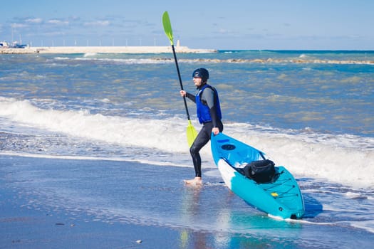 Men by sea kayaking. Traveling by kayak. Leisure activities on the water.