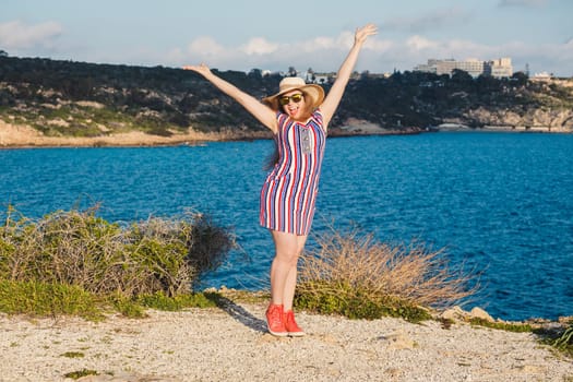 lifestyle and travel concept - beautiful happy woman enjoying summer outdoors.