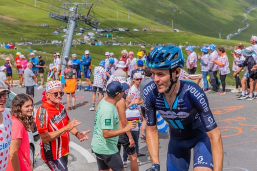 Col du Tourmalet, France - July 06 2023: Chris Hamilton climbig the road to Col du Tourmalet in Pyerenees mountains during the stage 6 of Le Tour de France 2023.