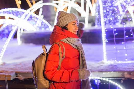 pretty funny girl having fun outdoor in winter. Christmas, city and winter holidays concept.