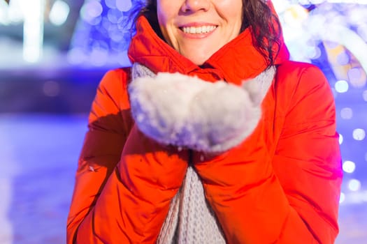 pretty funny girl having fun outdoor in winter. Christmas, city and winter holidays concept.