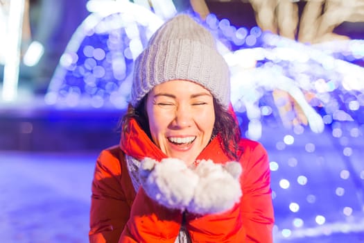 pretty funny girl having fun outdoor in winter. Christmas, city and winter holidays concept.