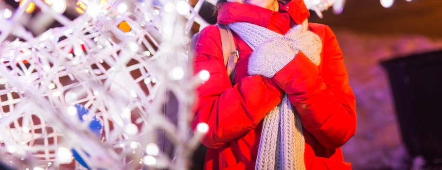 pretty funny girl having fun outdoor in winter. Christmas, city and winter holidays concept.