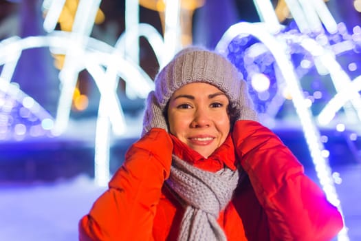 pretty funny girl having fun outdoor in winter. Christmas, city and winter holidays concept.