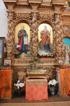 Wooden iconostasis in the Catherine Church in the city of Chernihiv. Religion in Ukraine. Slavonic church within