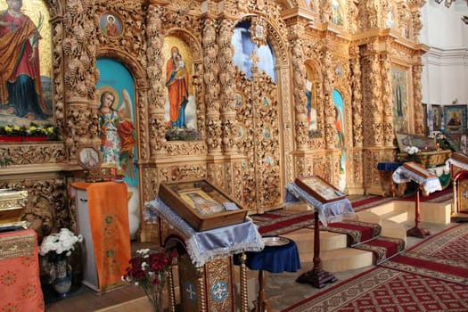 Wooden iconostasis in the Catherine Church in the city of Chernihiv. Religion in Ukraine. Slavonic church within