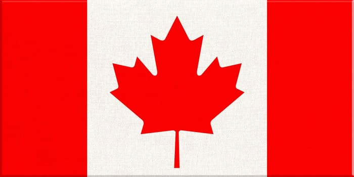 Flag of Canada. Canadian flag on fabric surface with red maple leaf on white background. Canadian national flag on textured background. Fabric Texture. American country