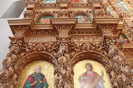 Wooden iconostasis in the Catherine Church in the city of Chernihiv. Religion in Ukraine. Slavonic church within