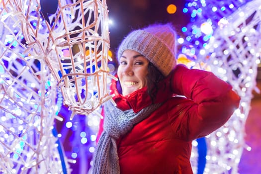 pretty funny girl having fun outdoor in winter. Christmas, city and winter holidays concept.