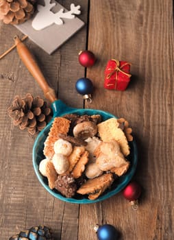Christmas cookies in a bowl on a wooden table, seasonal or traditional food