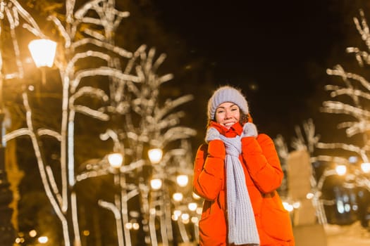 pretty funny girl having fun outdoor in winter. Christmas, city and winter holidays concept.
