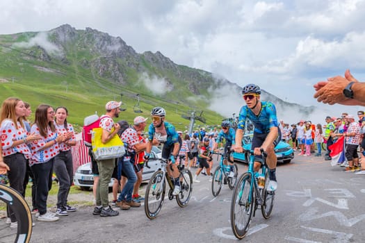 Col du Tourmalet, France - July 06 2023: Team Astana climbig the road to Col du Tourmalet in Pyerenees mountains during the stage 6 of Le Tour de France 2023.