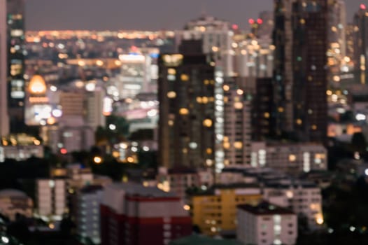 Cityscape blurred abstract background with bokeh urban lights at twilight