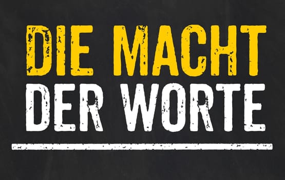 Blackboard with the text The power of words in german - Die Macht der Worte