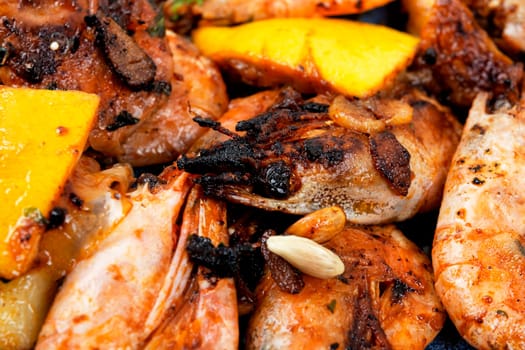 Roasted unpeeled shrimp on a plate. Grilled prawns or shrimps, seafood.